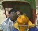 Errol pulls Roland around in a
                            rickshaw